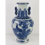 A late 19th / early 20th century blue and white Oriental baluster vase, unsigned, 38cm high.