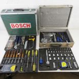 A Bosch flight case type tool box. Together with a toolkit in metal flight box. Two items.
