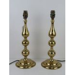 A pair of brass table lamps, 38cm high.