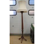 A carved mahogany Corinthian lamp standard, highly carved capital upon reeded column,