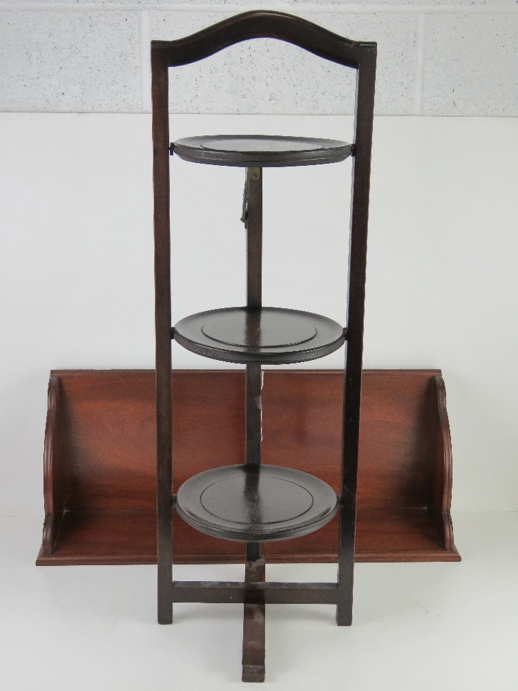 A c1930s folding lazy Susan together with a mahogany bookshelf, 67.5cm wide. Two items.