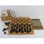 A vintage Staunton chess set in original box togther with a quantity of vintage draughts,