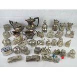A silver plated tea set together with a large quantity of silver plated money boxes.