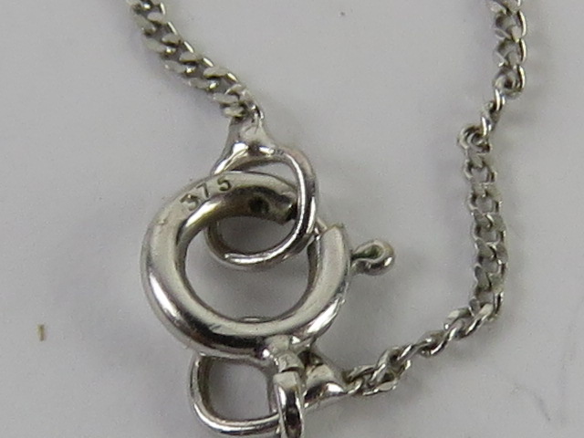 A 9ct white gold diamonique pendant and chain. - Image 3 of 4