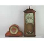 An early 20thC mantle clock having brass chaptering. Together with a contemporary wall clock.