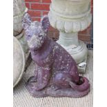 A pre-cast garden statue of an Alsatian / German Shepherd.