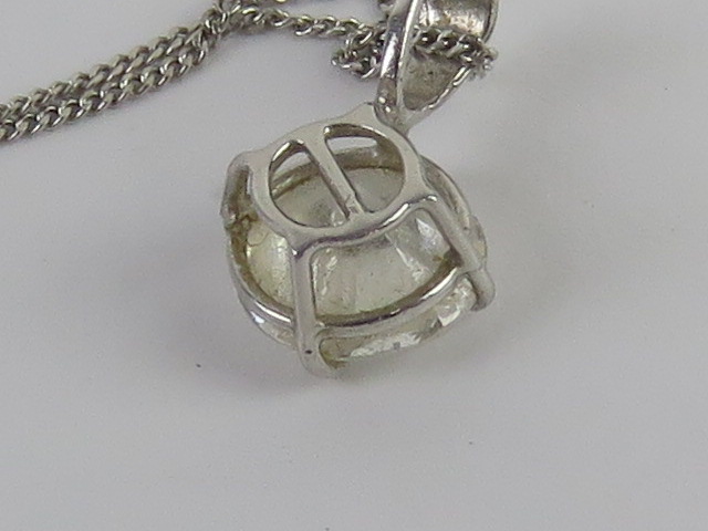 A 9ct white gold diamonique pendant and chain. - Image 4 of 4