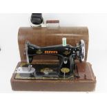 A vintage sewing machine marked Consul, in case.