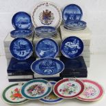 A large collection of Royal Copenhagen and other decorative plates.
