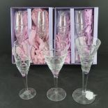 Edinburgh crystal; a set of four champagne flutes in original boxes, spare loose flute.