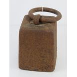 A cast iron weight with loop handle, for use as a door stop standing approx 23cm high.