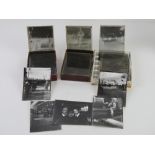 A quantity of black and white magic lantern type projector slides.
