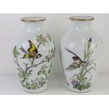 A pair of Franklin Porcelain vases being Woodland Bird and Meadowland Bird,