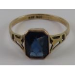 A delightful Art Deco 9ct rose gold ring having central octagonal faceted royal blue glass stone,