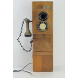 A late 20thC Astral England wall telephone (a/f).