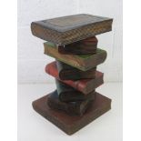 An occasional table in the form of a stack of books. 52.5cm high.