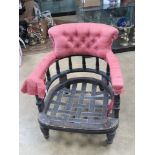 A late Victorian tub armchair raised over turned legs terminating in castors, for re-upholstery.