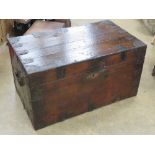An antique tin lined trunk having metal corner bracing and end handles measuring approx 91 x 55 x