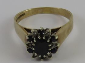 A 9ct gold diamond and sapphire cluster ring, hallmarked 375, size S, 4.7g.