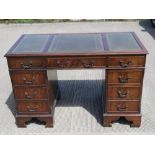 A reproduction Georgian style green leather topped pedestal desk, 120 x 60 x 78cm.