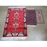 A woollen prayer rug in blue and red ground 65 x 30cm, together with an Agadir 'silk effect' rug,