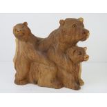 A Balinese hand carved mother bear with babies standing 22cm high.