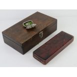 A vintage Japanese style lacquered pen box having cherry blossom design upon together with a