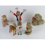 Five mid century clockwork toys inc cat music box, bunny rabbit with maracas, juggling clown (a/f),