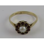 A delightful vintage garnet and split pearl floral cluster ring, hallmarked Birmingham, size O, 1.