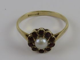 A delightful vintage garnet and split pearl floral cluster ring, hallmarked Birmingham, size O, 1.