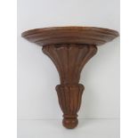 A hand carved wooden plinth.