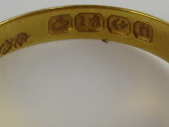 An 18ct gold Gypsy ring having three star set diamonds, hallmarked Birmingham, size M, 2.6g. - Image 2 of 2
