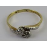 A two stone diamond ring in 18ct gold and platinum, each round cut stone approx 3.2mm dia x 2.2mm.