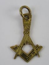 Masonic; a square and compasses design pendant, no apparent hallmark, 1g.