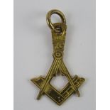 Masonic; a square and compasses design pendant, no apparent hallmark, 1g.