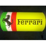 A contemporary Ferrari-themed illuminated and barrel-fronted wall sign complete with switch,