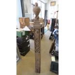 An antique carved oak newel post having a well carved bird upon, 150cm in length.