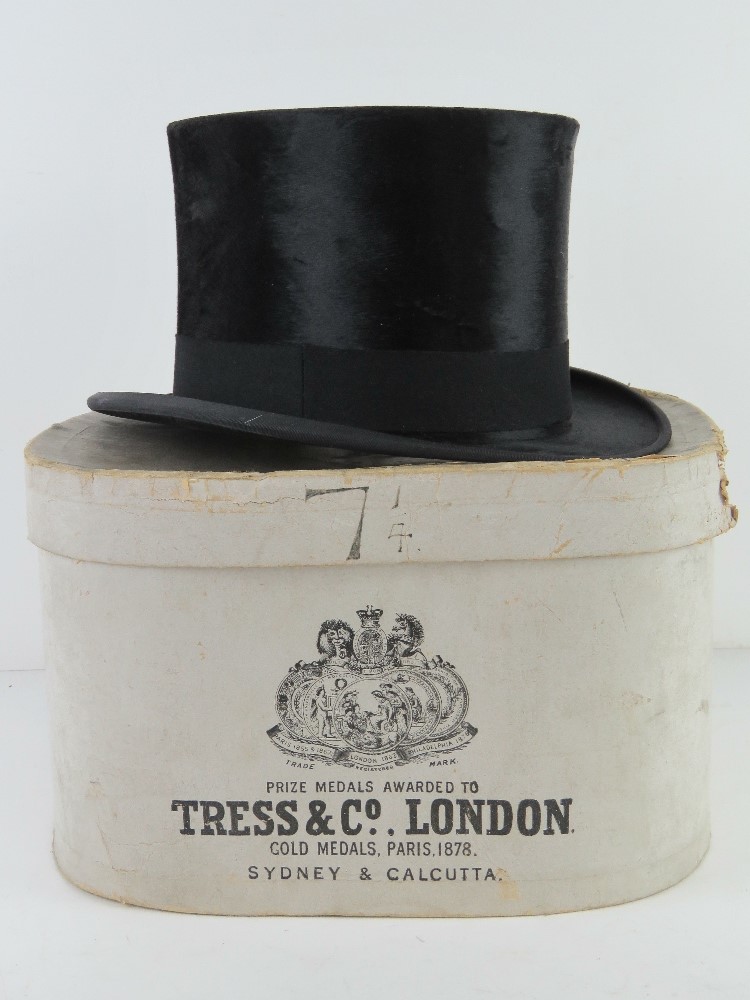 A felt top hat by Tress and Co, with original paper box, size 7 1/4.