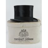 A felt top hat by Tress and Co, with original paper box, size 7 1/4.