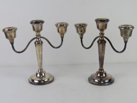 A pair of HM silver three sconce candelabra bearing presentation inscription dated 1972,