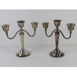 A pair of HM silver three sconce candelabra bearing presentation inscription dated 1972,