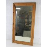A vintage pine framed mirror having good quality heavy glass within and measuring 50 x 94cm.