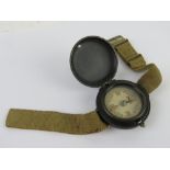 A WWII SOE jump wrist compass with strap