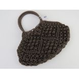 A Hobbs crochet type handbag in brown approx 34cm wide.