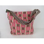 A fabric tote bag having leaf pattern in pink 'as new', approx 38 x 34cm.