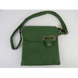 A green cross body handbag approx 25cm wide.