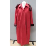 An Aqua Scutum of London felted coat with faux fur fringe in red, approx measurements 48" chest,