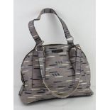 Radley; a grey and navy patterned leather handbag, some scuffs noted to corners, 34cm wide.