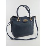 A navy blue tote bag with shoulder strap and woven handles, approx 30cm wide.