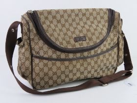 A vintage canvas bag marked for Gucci having studs further marked for Gucci, unauthenticated,